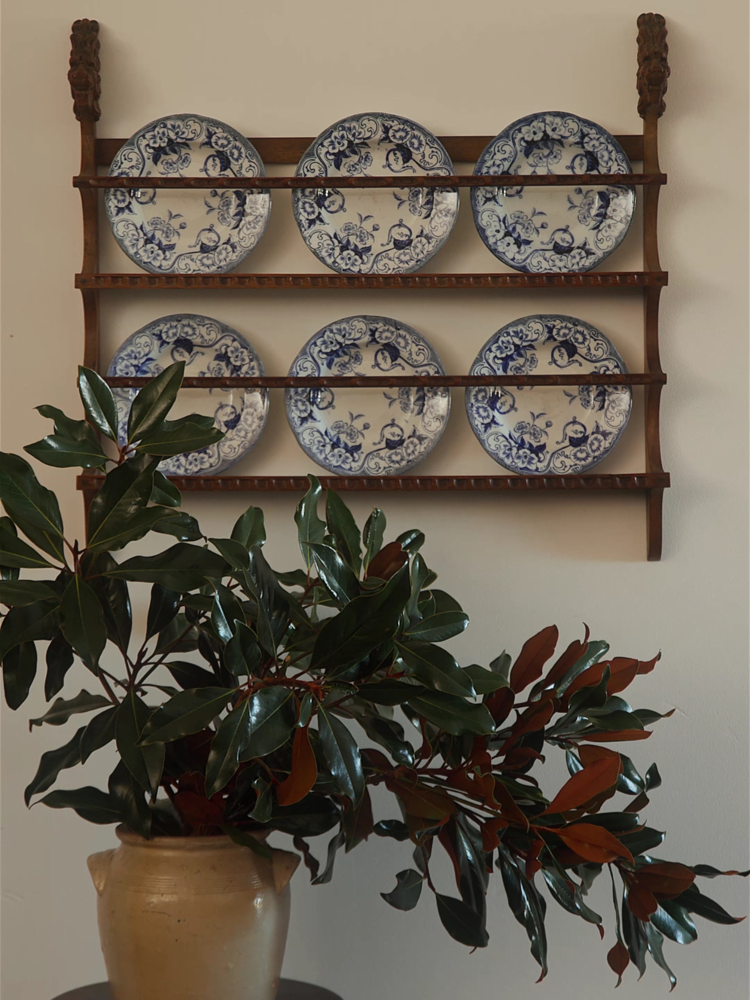 Carved Oak Plate Rack with Lion Head Terminals