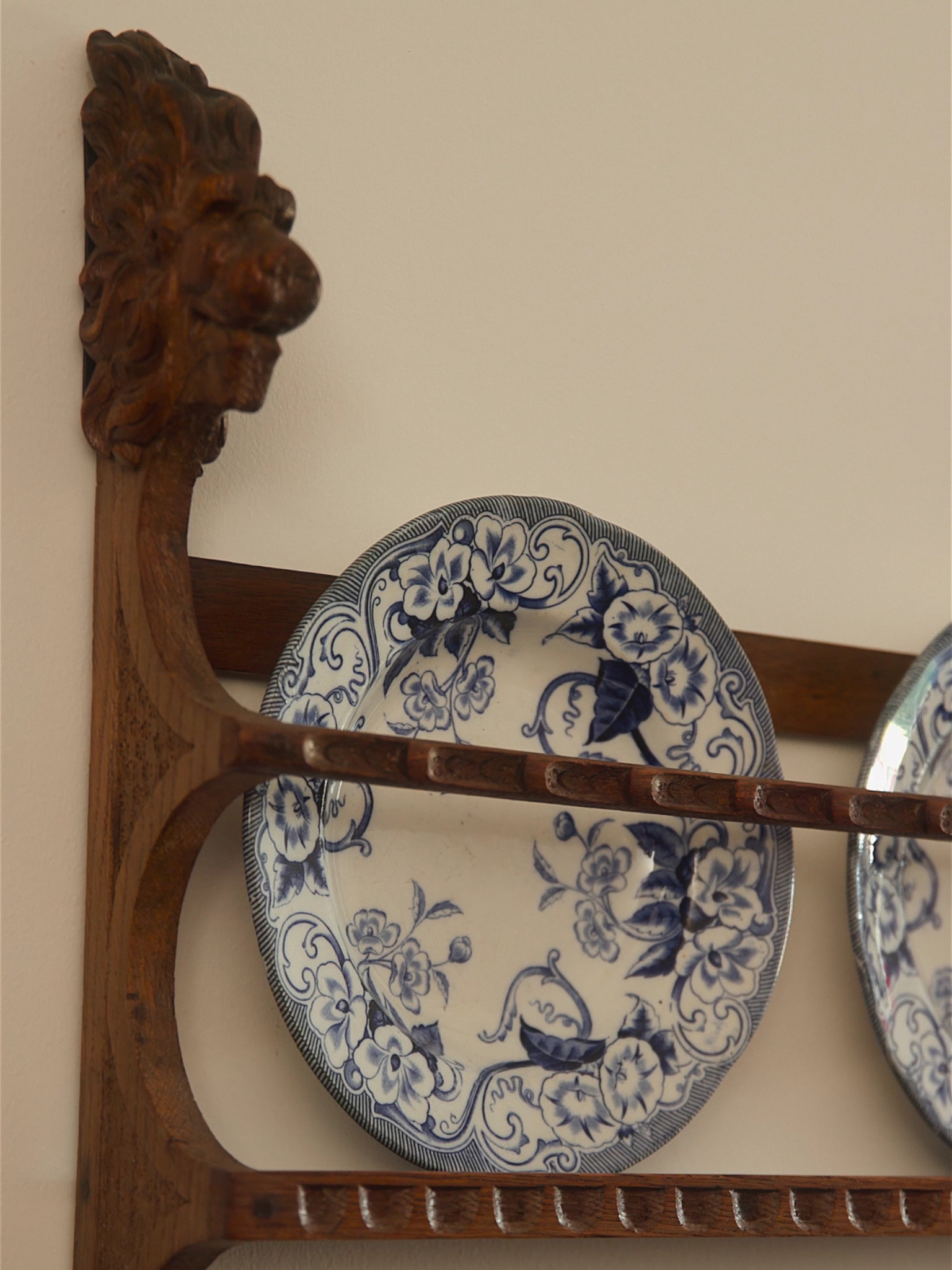 Carved Oak Plate Rack with Lion Head Terminals