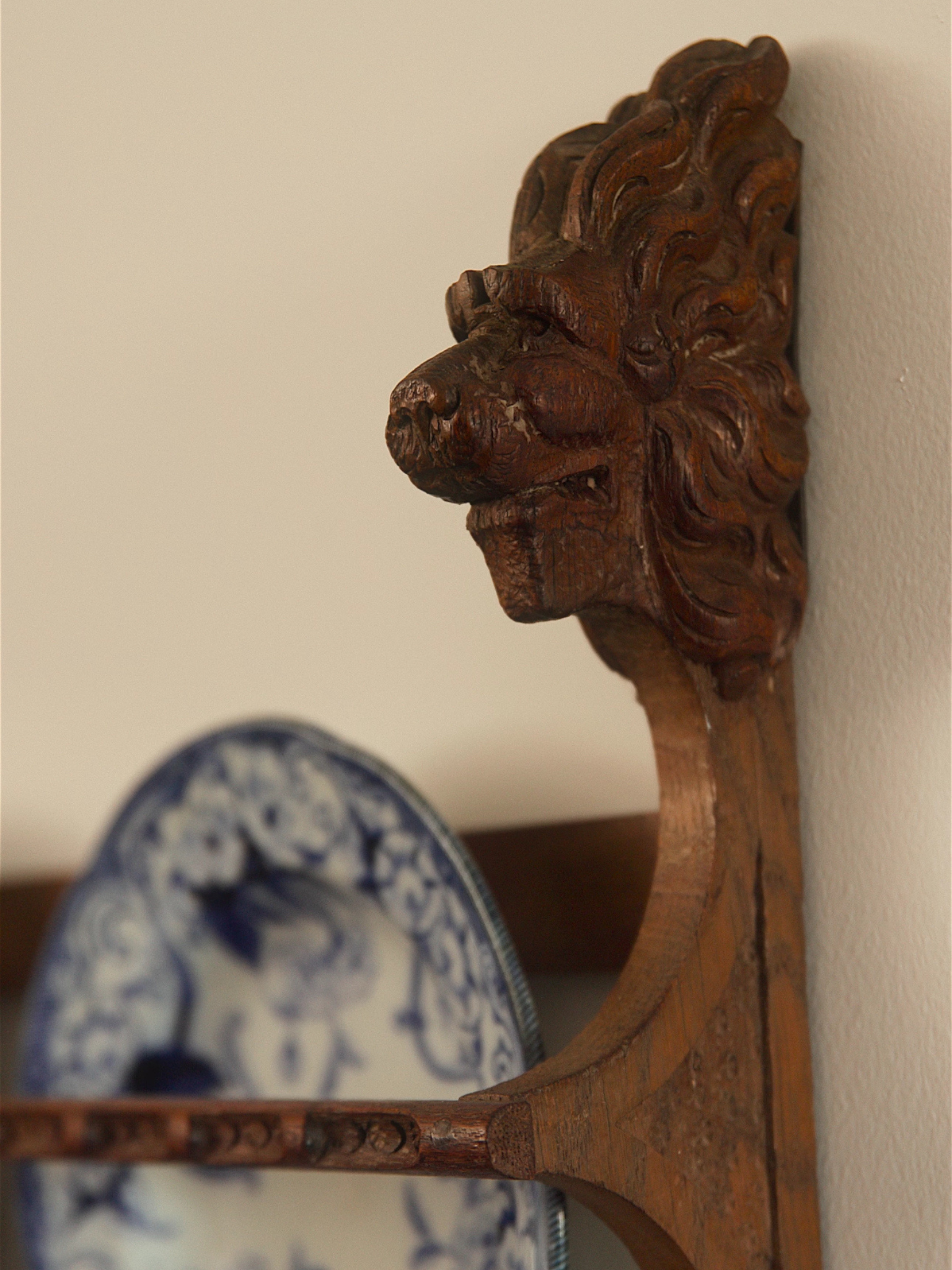 Carved Oak Plate Rack with Lion Head Terminals