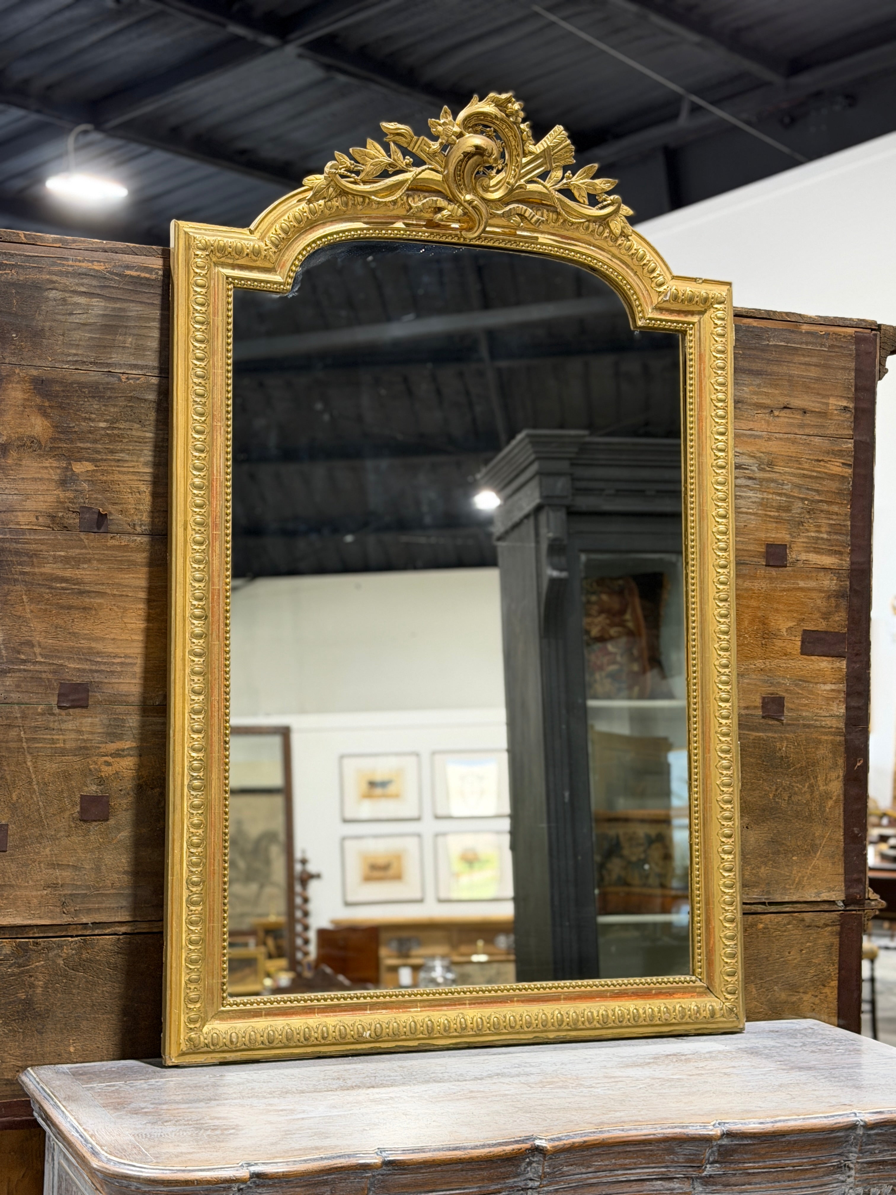 Monumental French Louis XVI Style Giltwood Mirror with Ribbon Crest