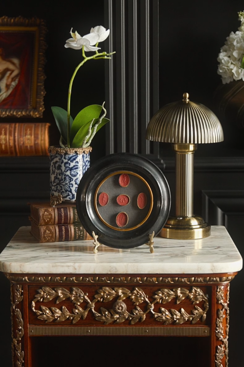 Oval Carnelian-Tone Intaglios with Classical Figures in Ebonized Frame