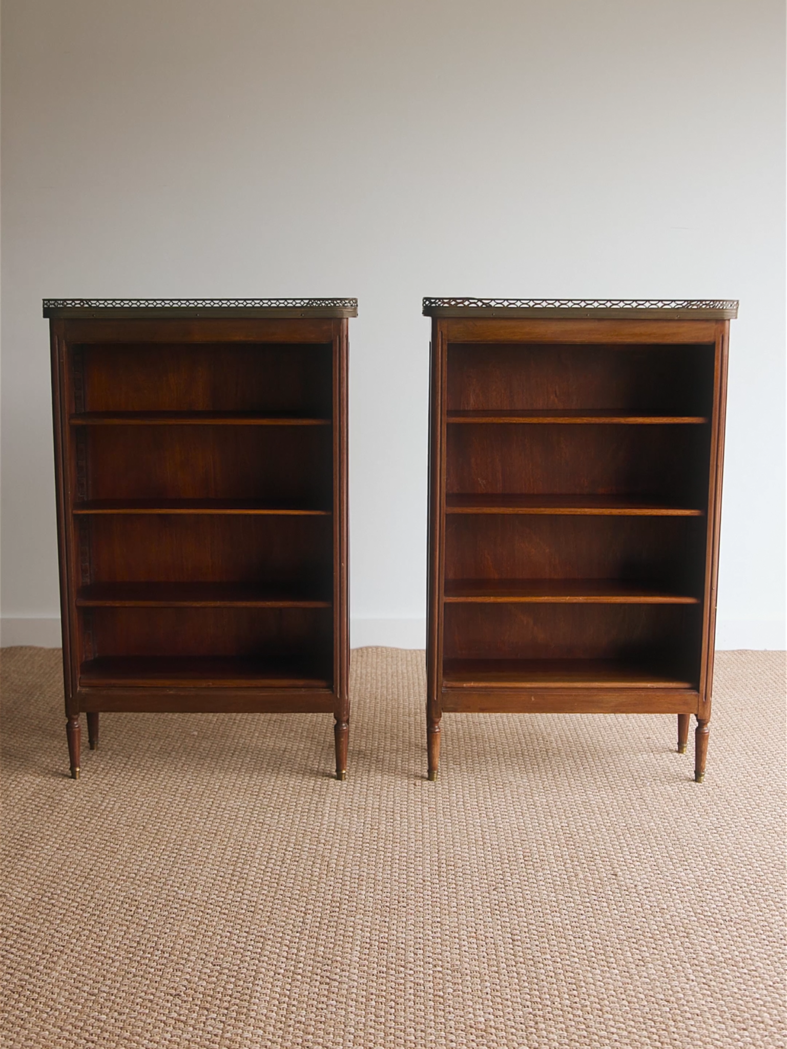 Pair of French Louis XVI–Style Mahogany Pier Cabinets With Marble Tops & Brass Galleried Rims