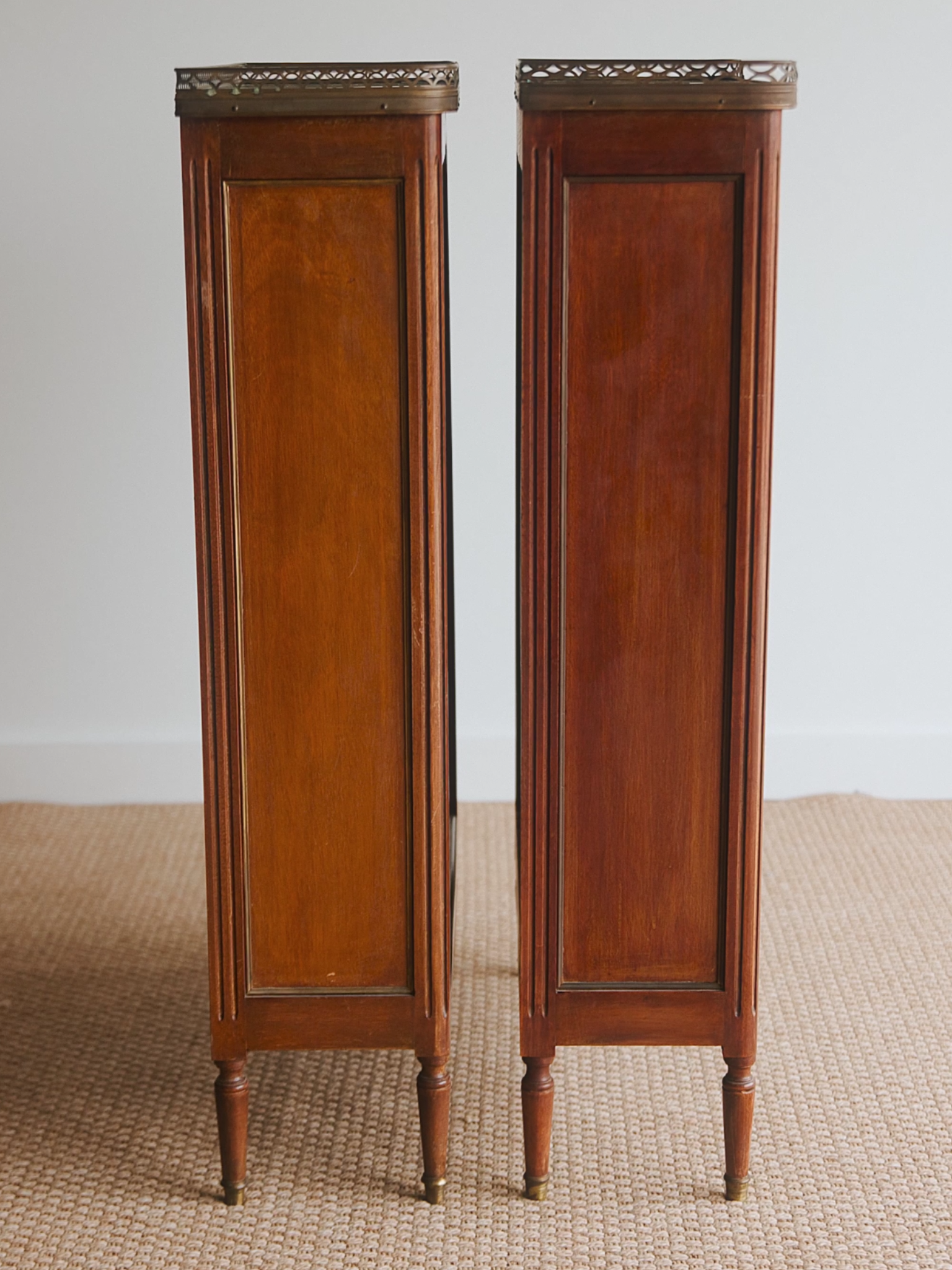 Pair of French Louis XVI–Style Mahogany Pier Cabinets With Marble Tops & Brass Galleried Rims