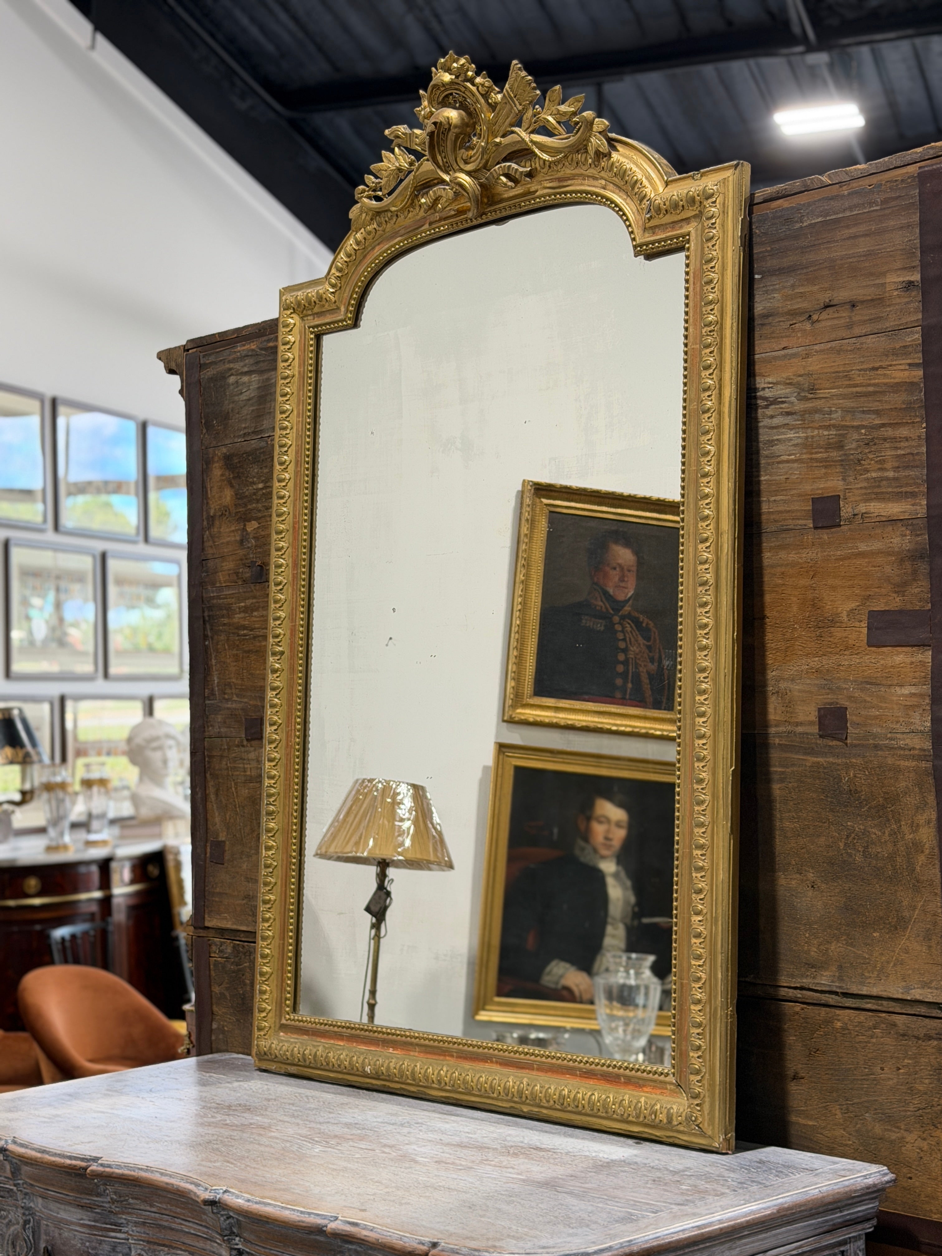 Monumental French Louis XVI Style Giltwood Mirror with Ribbon Crest