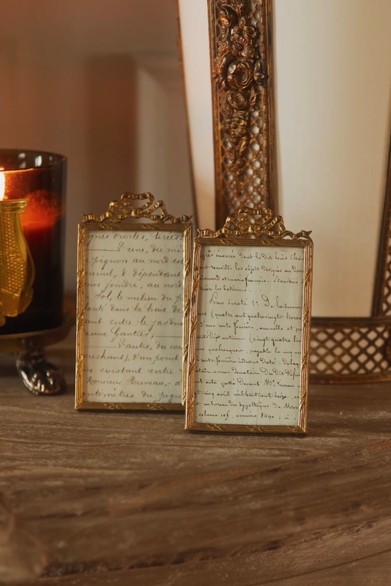 Pair of French Louis XVI Style Ribbon-Topped Brass Frames