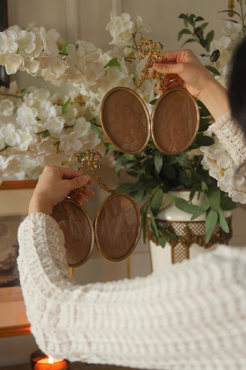 Pair of 19th Century French Gilt Bronze Double Oval Frames with Ribbon Crest