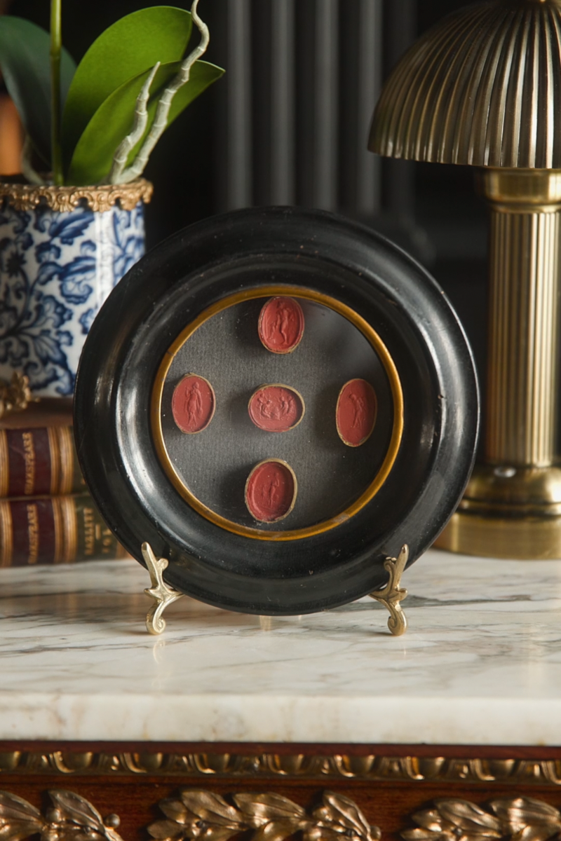 Oval Carnelian-Tone Intaglios with Classical Figures in Ebonized Frame